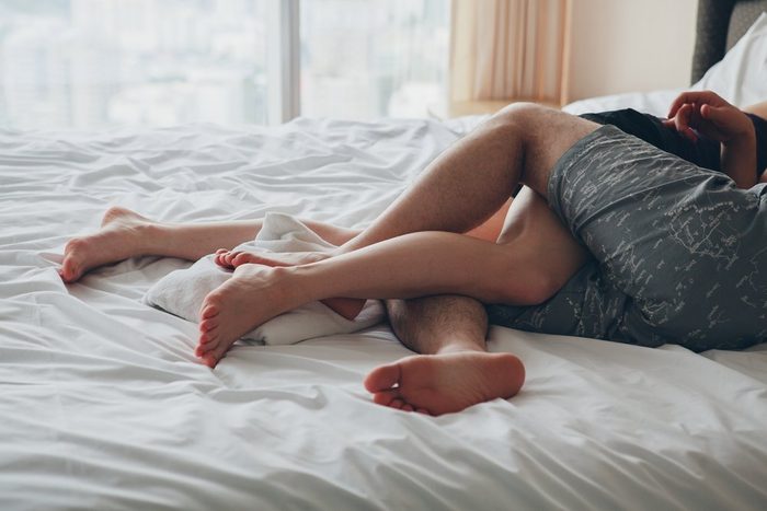 sex mistakes | couple with tangled legs in bed