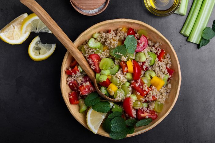 healthier grilling ideas | Quinoa salad with red and yellow bell peppers tomatoes, celery and grapes