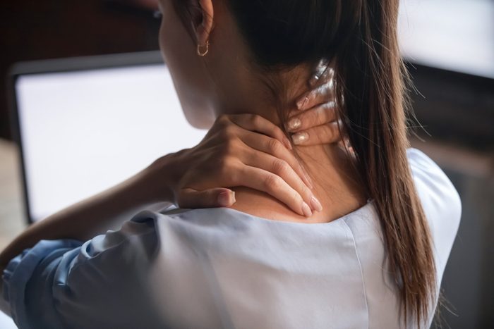 Fibromyalgia | rear view close up of woman with neck pain