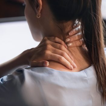 fibromyalgia | rear view close up of woman with neck pain