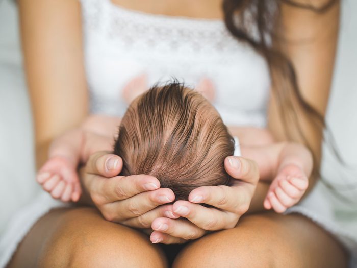 postpartum depression | woman holding baby
