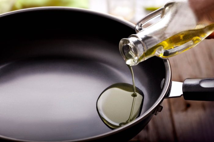 foods that lower your libido | oil being poured into a cooking pan
