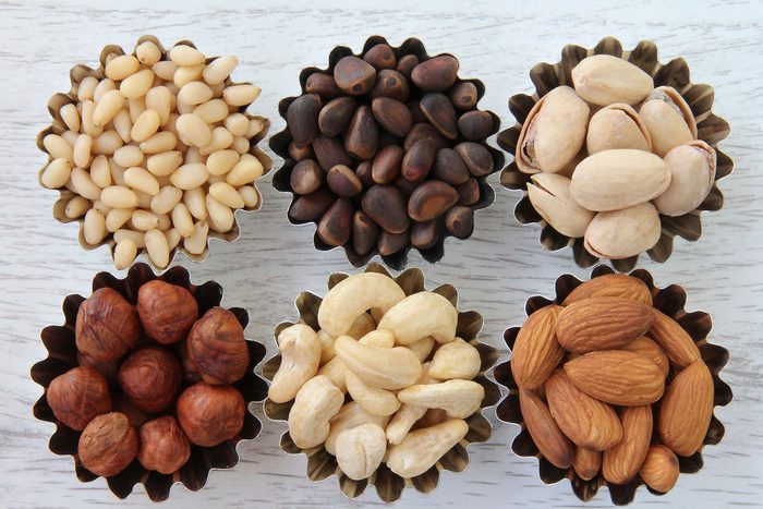 swollen feet | little cups of nuts including almonds, pine nuts, and pistachios