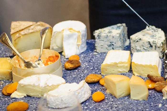 foods and drinks that cause migraines | Amazing selection of cheeses offered at table-side at a luxury hotel restaurant in Deauville, France.