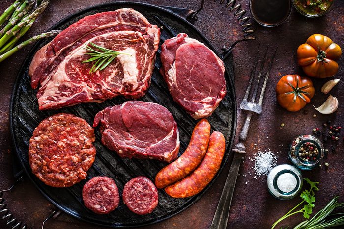 raw steak, burgers and sausages