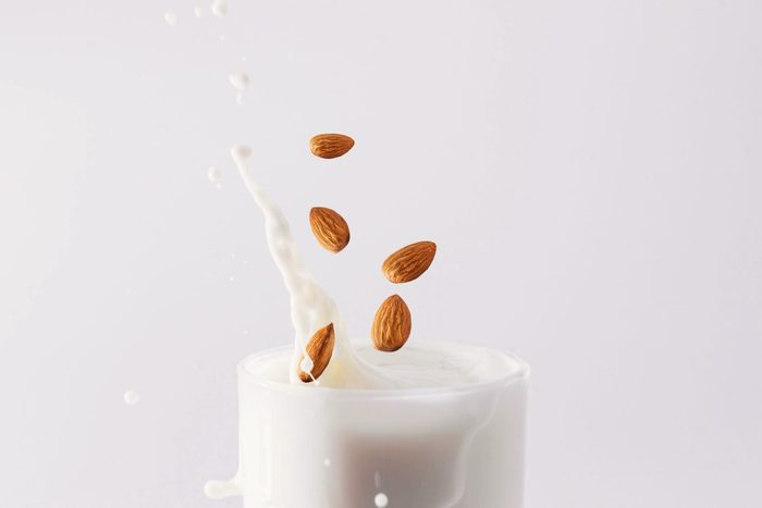 is almond milk good for you? | almonds splashing in milk