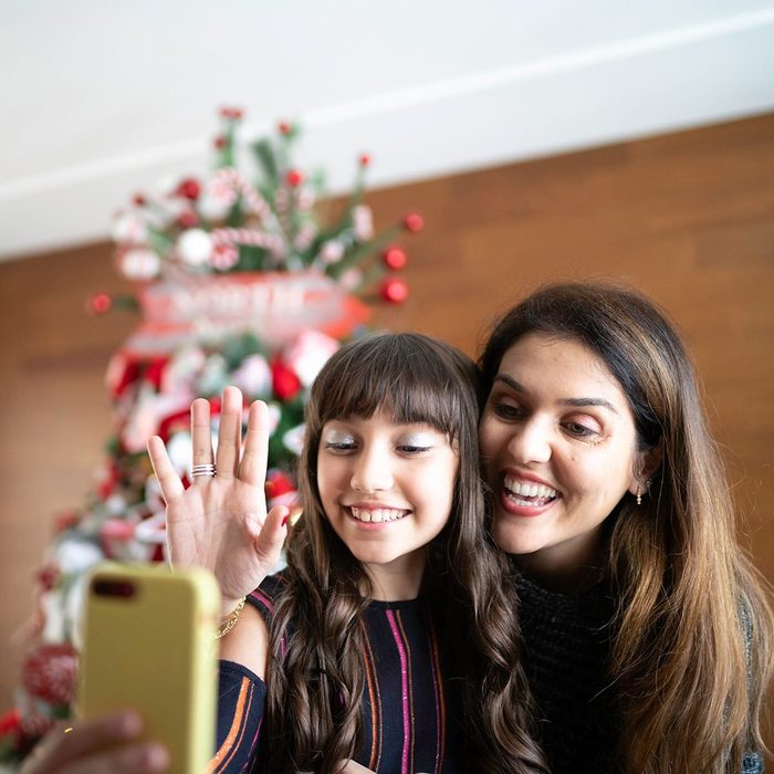 Mother and daughter making a video conference at christmas time