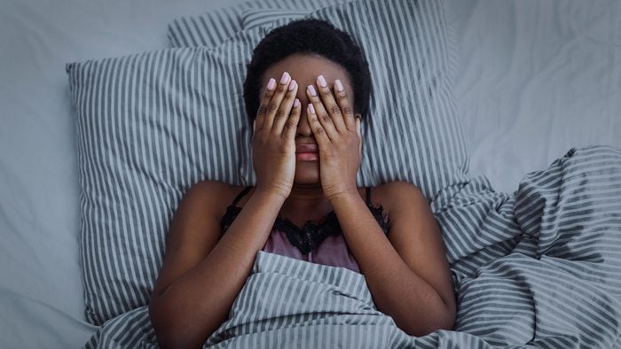 circadian rhythm disorder | African American Girl Closed Eyes With Hands In Bed