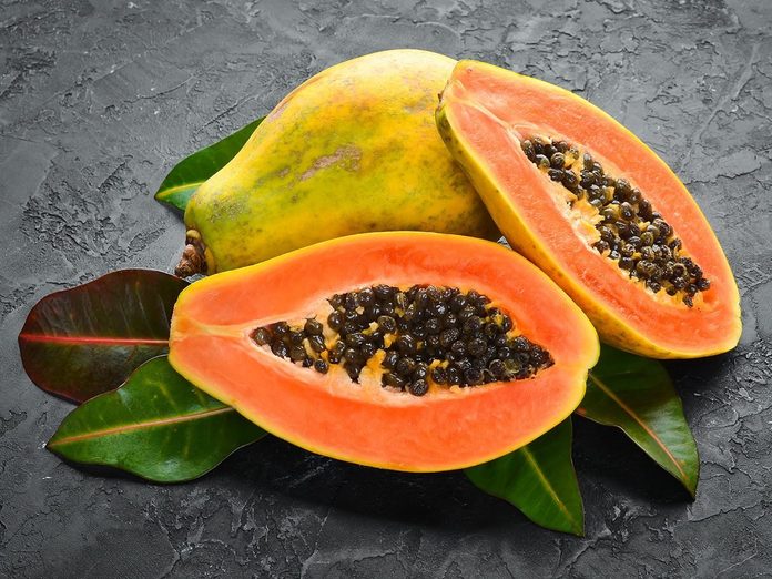 Fresh papaya on a stone ground.