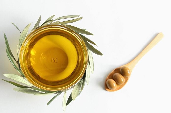 olive leaf tea | Olive Oil Bowl With Olive Branch And Green Olives Photo