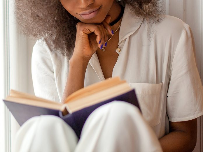 happiness books | Pretty,afro American,girl,with,reading,a,book,sitting,on,the