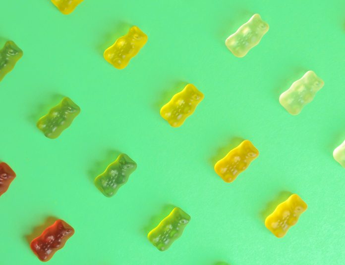 biotin supplements | Gummy,bear.,kids,vitamins,on,colorful,background.