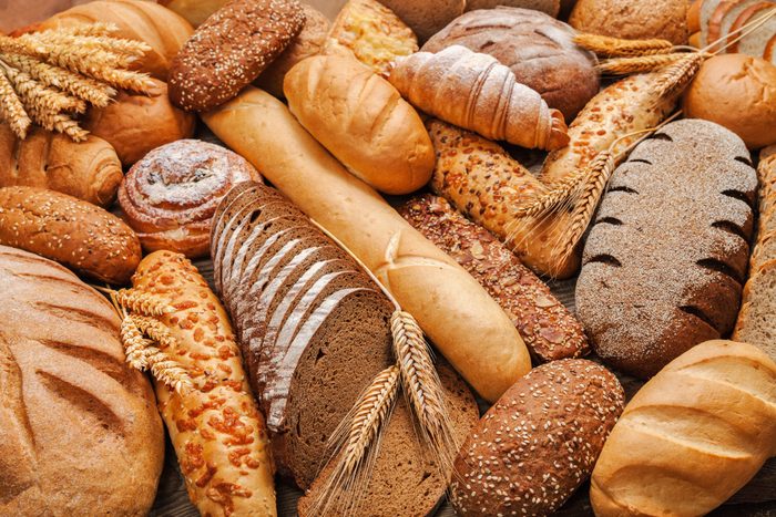 healthy bread | a stack of different breads on a table