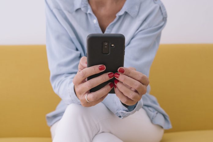 best therapy apps | Midsection Of Woman Using Mobile Phone While Sitting On Sofa