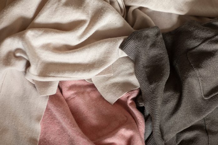 what is lyocell | Old,clothes,in,pink,and,grey,colors,laying,on,a