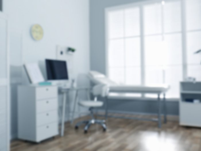 Blurred,view,of,modern,medical,office.,doctor's,workplace