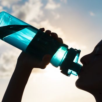 electrolyte drinks | Woman,drinking,water.