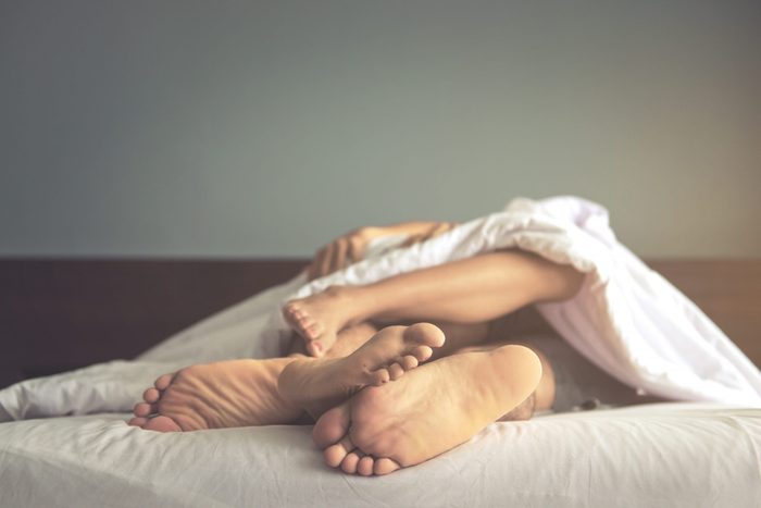 Close,up,of,feet,couple,having,sex,on,a,bed