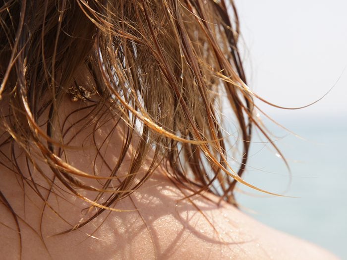 summer,hair,care,Woman's,hair,on,the,beach.,wet,hair,close,up,image.