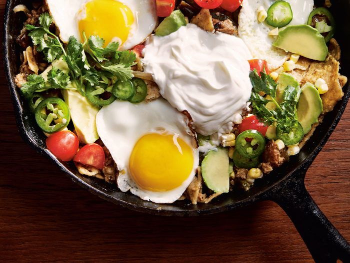 Chilaquiles recipe | image of chilaquiles in a cast iron on a table