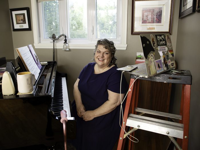working with a disability | corinna hodgson sitting in her home workspace