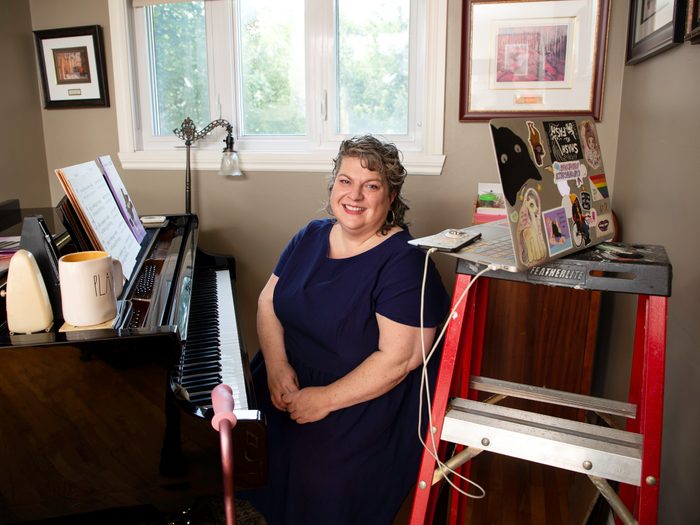 working with a disability | corinna hodgson sitting in her home workspace