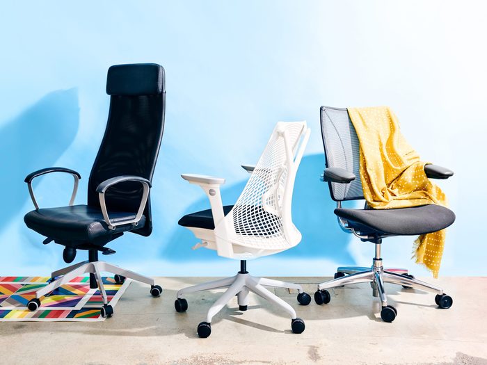 best ergonomic chairs | image of three chairs against a blue backdrop