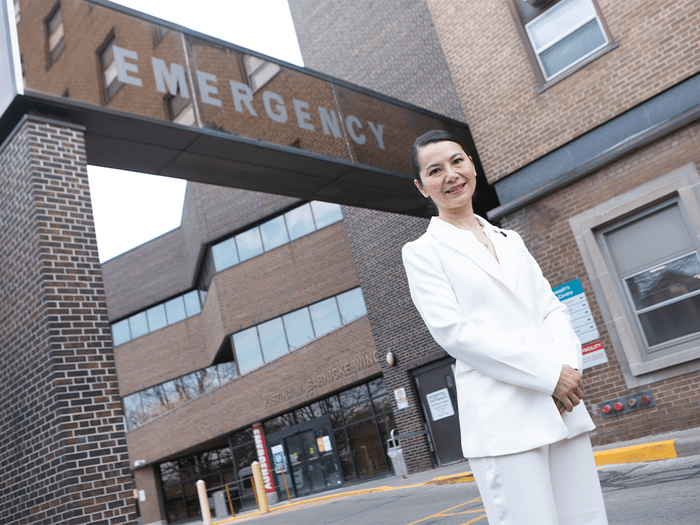 emergency management pandemic | Dr. Joan Cheng standing in front of the emergency department at St. Joseph's Health Centre