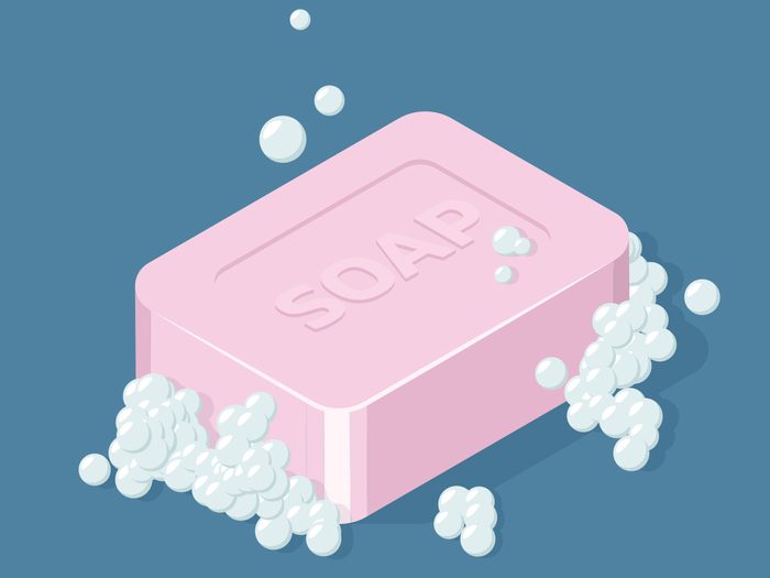 Photo of a pink bar of soap with bubbles on a blue background_Personal Hygiene History Canada Jake Gyllenhaal Ashton Kutcher Mila Kunis Bh Feature