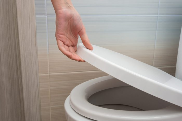 cloudy urine | The Hand Closes Or Opens The Toilet Lid