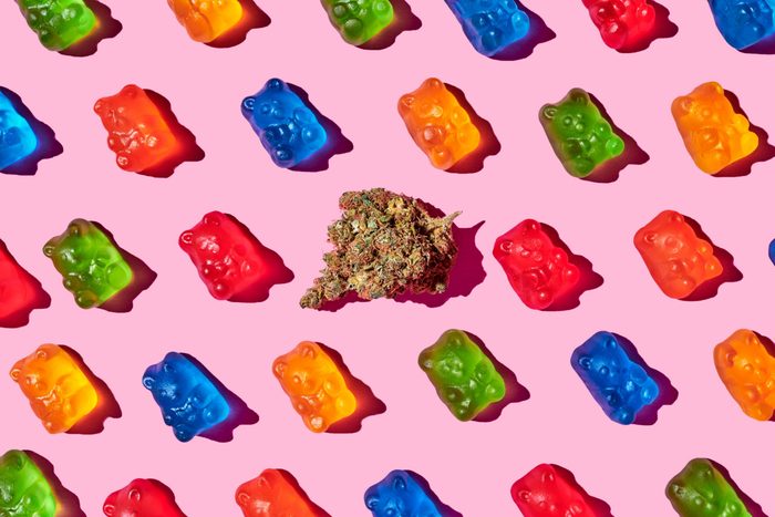 Recreational,marijuana,with,gummy,bears,on,a,pink,background
