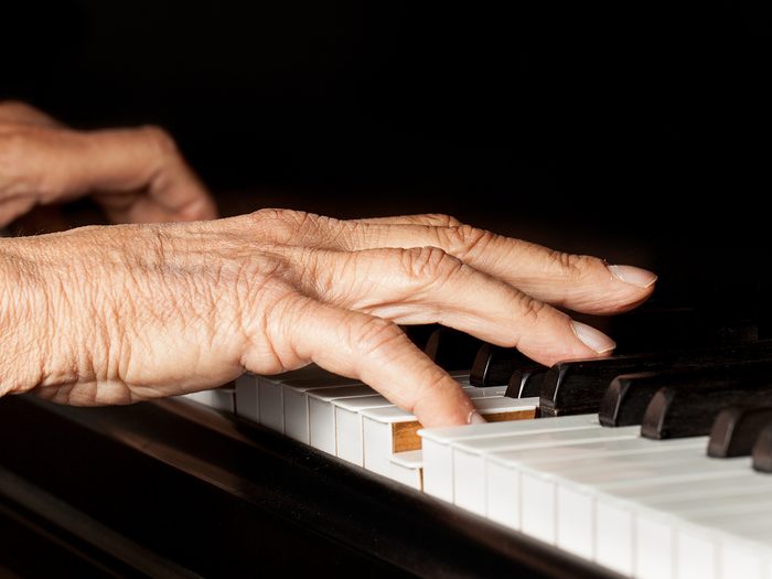 brain health now | Old,person's,hands,playing,the,piano.,close,up,view,of