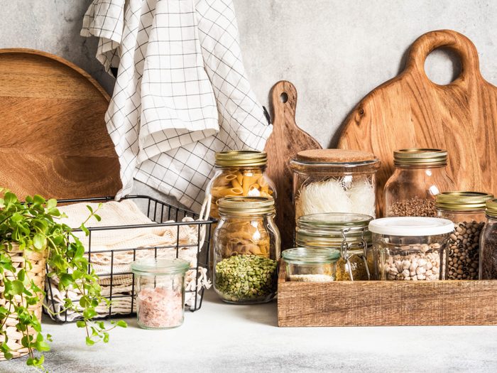 zero waste kitchen tips | jars and reusable kitchen tools on a kitchen counter