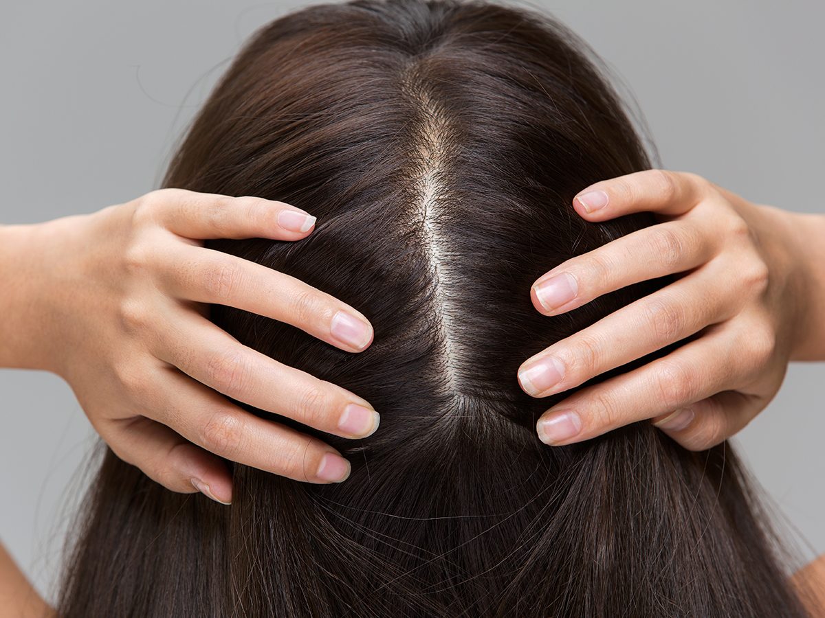 scalp serums | A,woman,is,massaging,her,scalp.