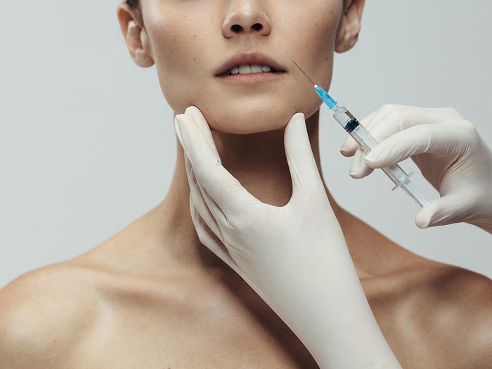 Portrait,of,young,woman,getting,cosmetic,injection.,close,up,of